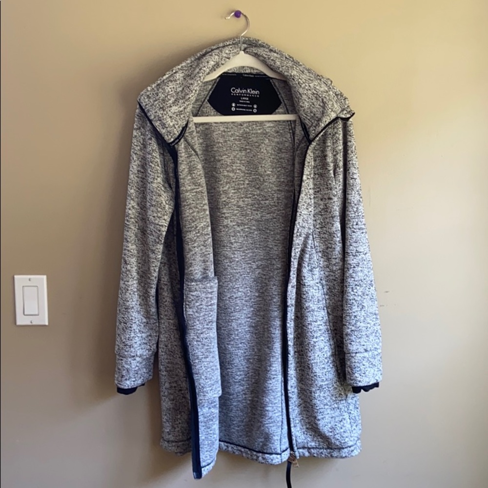 Calvin Klein long zip up jacket. Detachable hood.